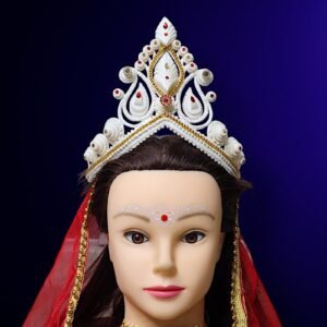 'Bridal Mukut' is made up of Pure organic product called Shola, which is a soft quality and skin friendly material. Bengali brides wear this shola mukut to maintain their tradition, royalty, beautification and bridal rituals.